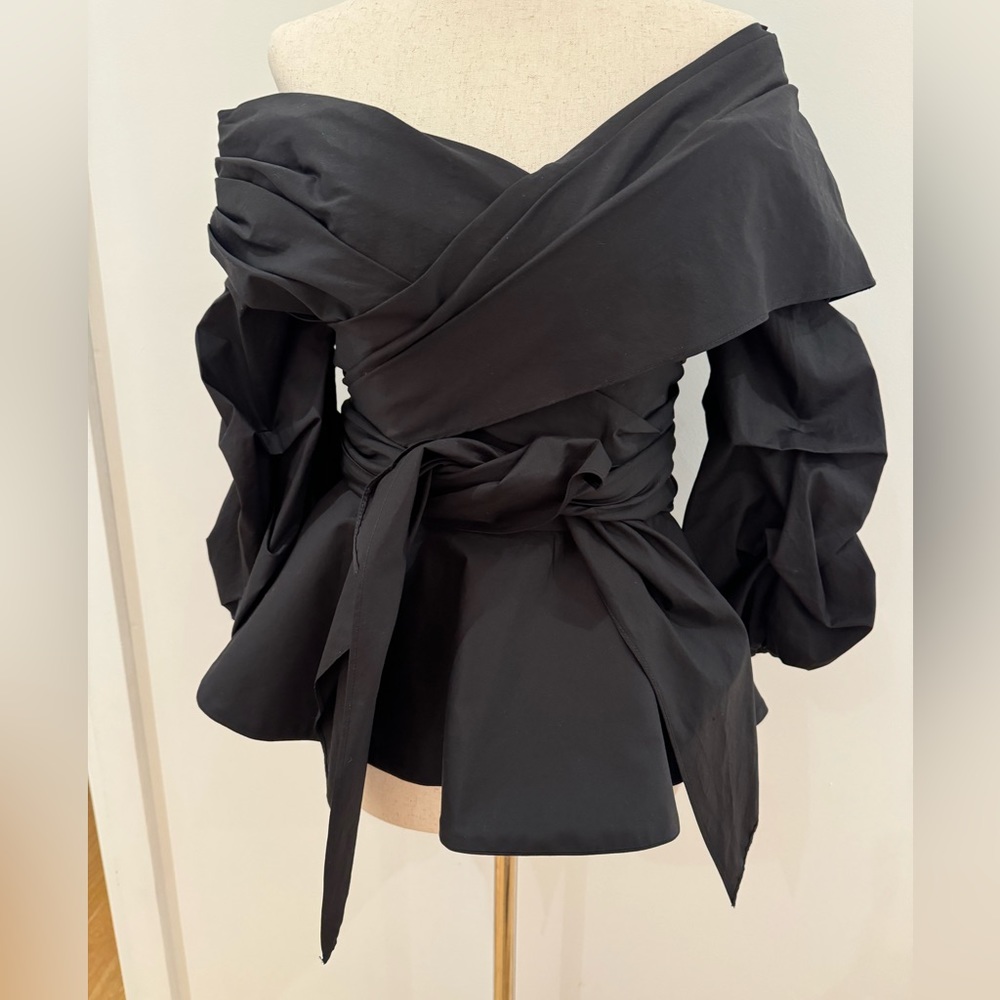 Johanna Ortiz off shoulder black top